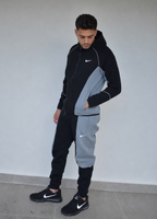 Conjunto Nike x NOCTA negro con línea gris de SOUTH, vista principal